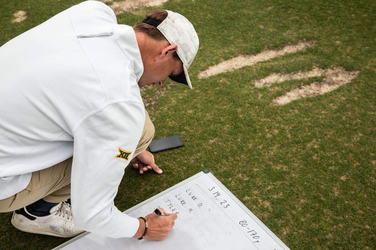 Mikkel taking notes at practice
